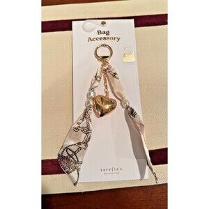 NWT Serafina Keychain/Bag Charm Featuring Cream-Colored Ribbon & Gold Heart